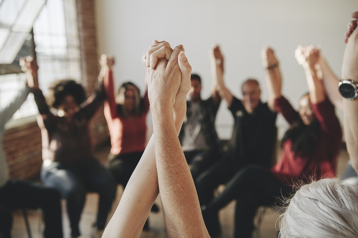 Group-therapy-hands-in-air